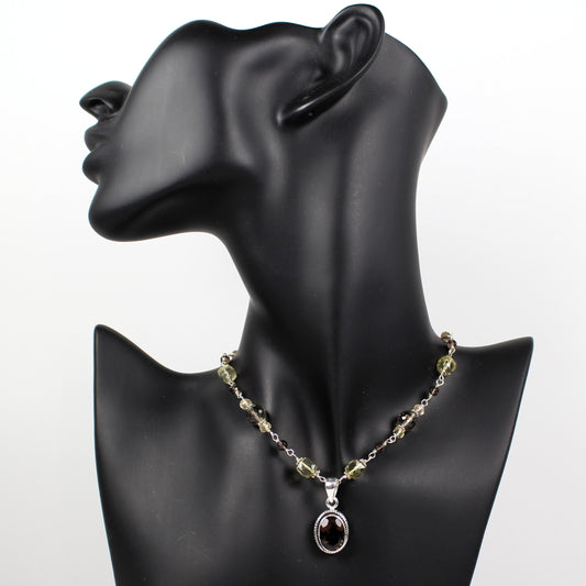 Faceted smoky quartz sterling pendant and hand wrapped faceted brown and yellow gemstones.