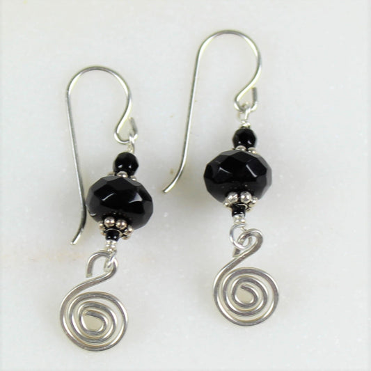 Sterling silver hammered spiral dangles off of gently faceted black onyx on sterling wire earrings