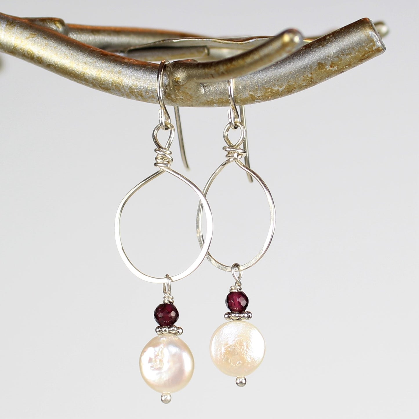 Sterling drop earrings with larger hammered wire loop, faceted garnet and white coin pearl