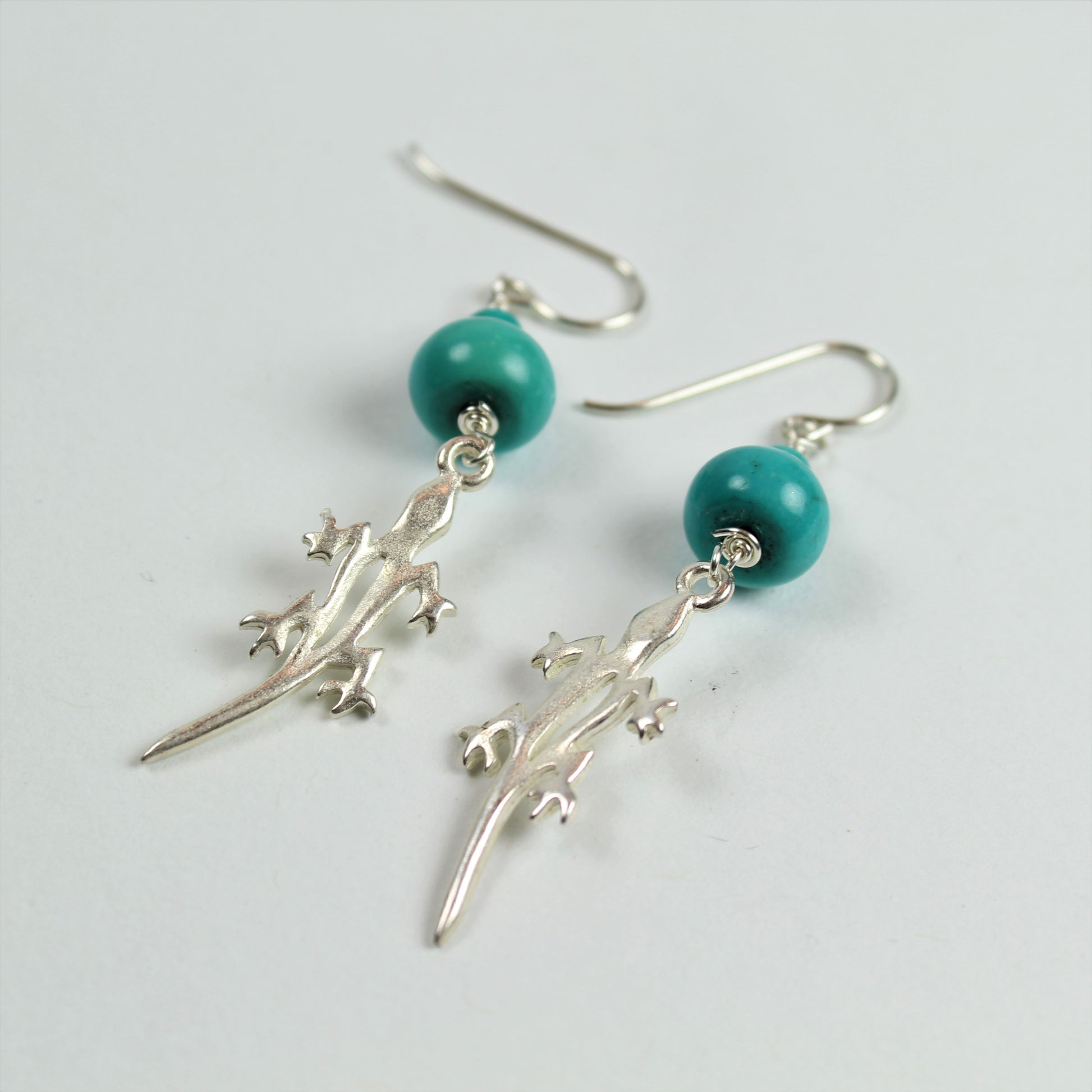 2 inch long dangle earrings with blue turquoise above brushed silver lizards