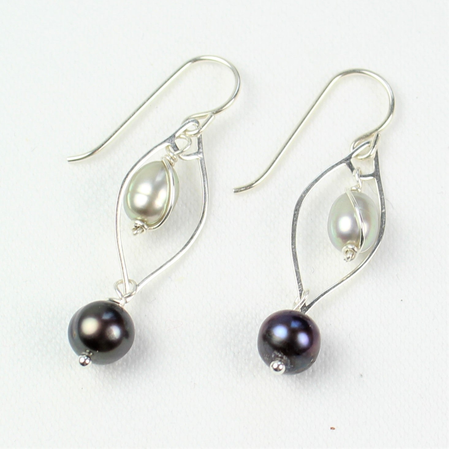 1 1/2 inch long dangle earrings with sterling silver and light and dark gray freshwater pearls.