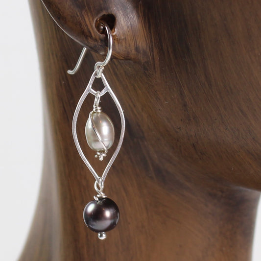 Sterling silver teardrop finding with light and dark gray freshwater pearls. on this wire earring