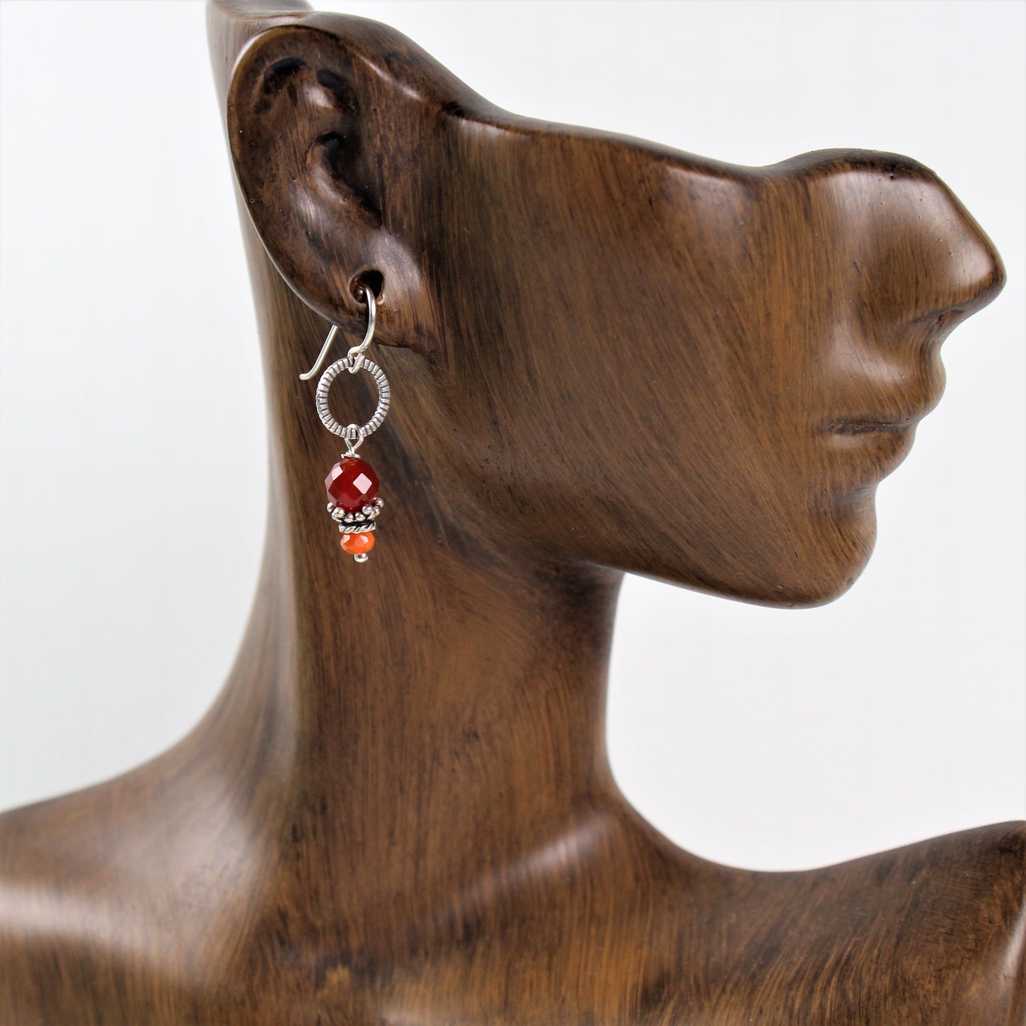 1 1/2 inch carnelian faceted earrings with bali silver bead cap and antiqued notched sterling loop