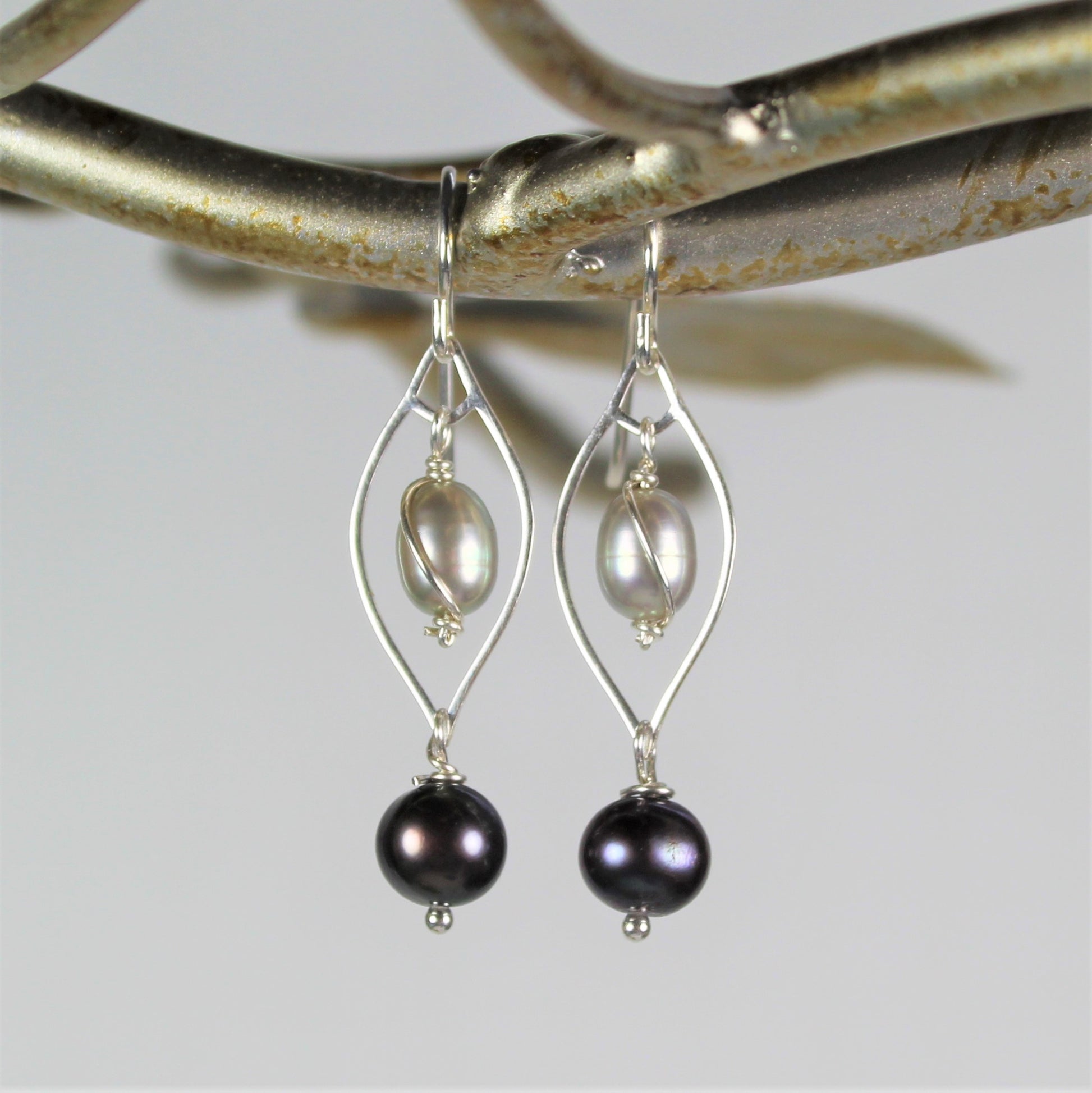 1 1/2 inch long dangle earrings with sterling silver and light and dark gray freshwater pearls.